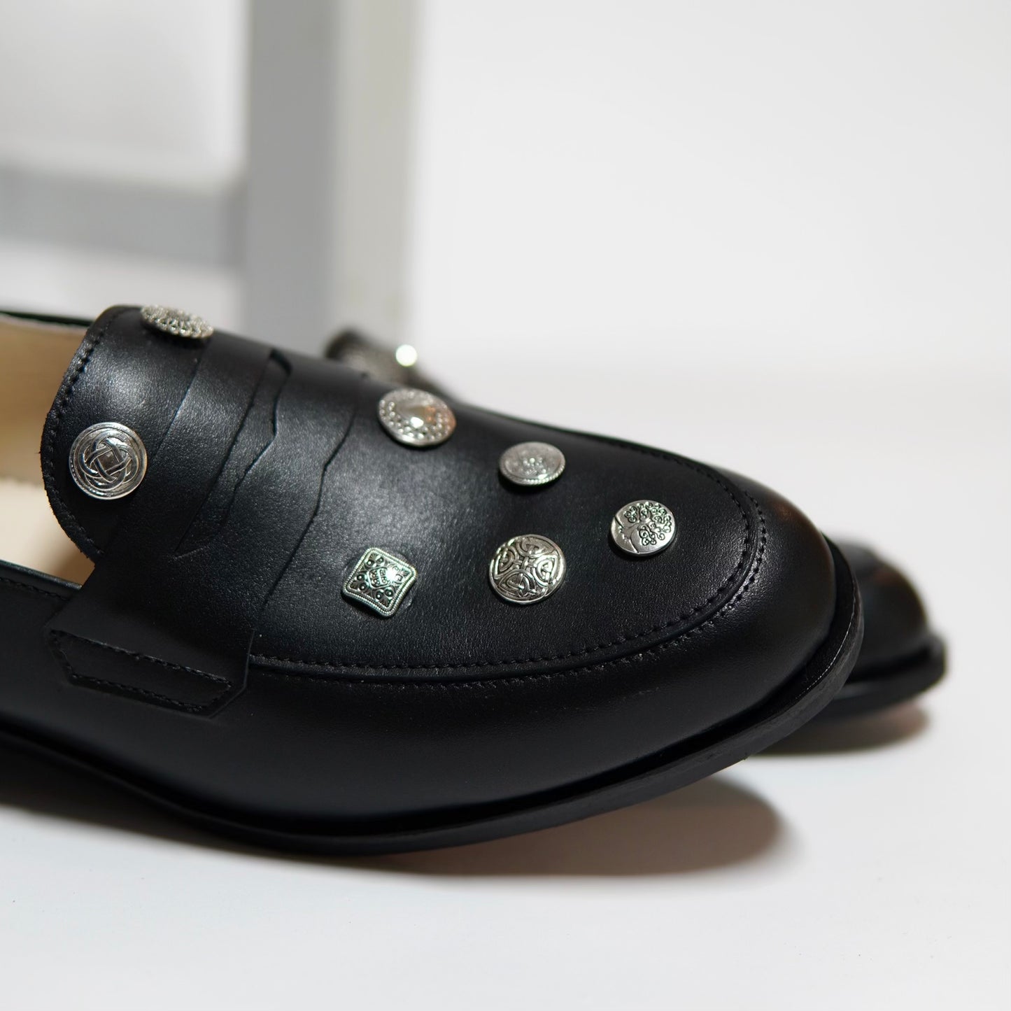 Dára Alloy Buttons black penny loafers