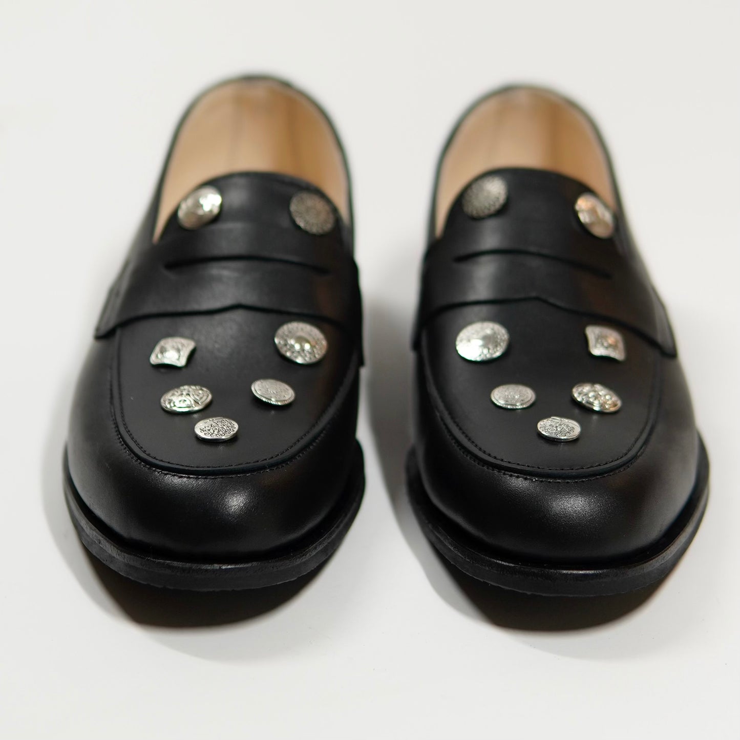 Dára Alloy Buttons black penny loafers